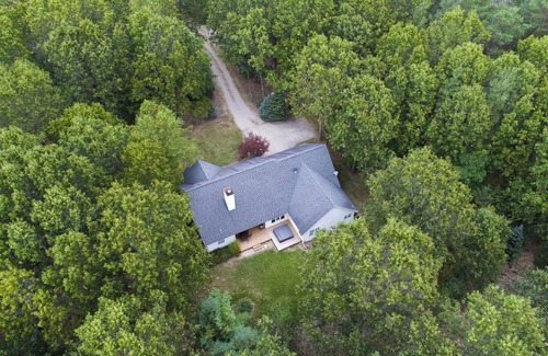 Fennville House | Upscale Wooded Retreat. Fenced yard, Hot tub, Firepit & Game room.