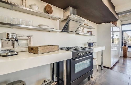 Brown and Stetson Business Condo | Urban chic loft, twinkling lights & mountain views