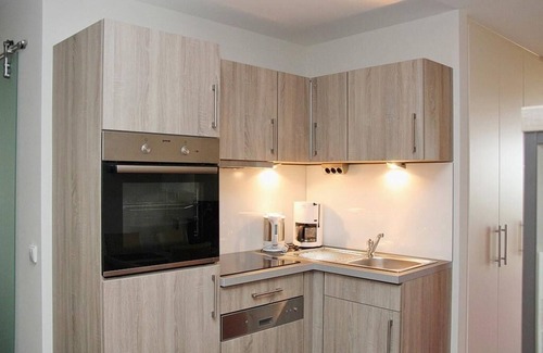 Wremen Apartment | Vacation apartment near the beach with sauna, balcony with beach chair and wonderful view