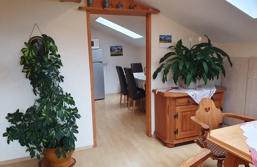 Grassau Apartment | Vacation apartment 95 sqm, for 2-5 pers., 2 bedrooms, kitchen with dishwasher, spacious living room with balcony. Living room, balcony.