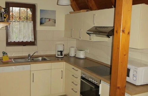 Dorumer Neufeld House | Vacation home "Opi Huck 26" - Comfortable North Sea enjoyment with fireplace and terrace