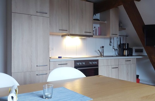 Eckwarden Apartment | Vacation home Herter, WiFi, garden, play equipment, lounger/play area, barbecue