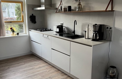Medemblik House | Vacation home on the water with two private jetties and boat, W-Lan