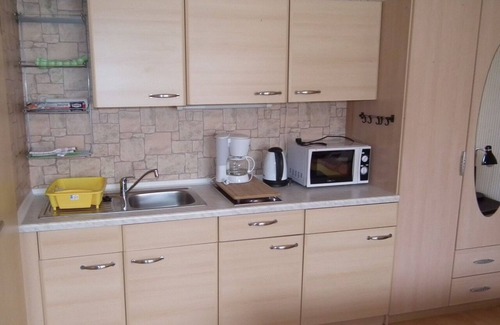 Quedlinburg Apartment | Vacation room 2 persons Double bed Kitchenette 2 armchairs Table Bath/WC