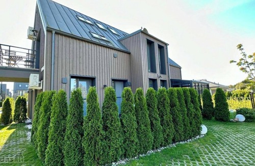 Palanga Apartment | Vaivorykstes Namai with Heated Pool by Hostlovers