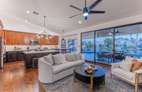 Crystal Shores House | Val Vista Lakefront Gem, Game Room, Htd Pool, Patio TV, Fire Pit, Kayaks, Bikes
