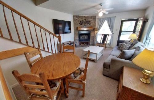 Red River House | Valley Condo 101 Creekside - End Unit - Wi-Fi - Hot Tub - Fireplace - Washer - Dryer - Playground
