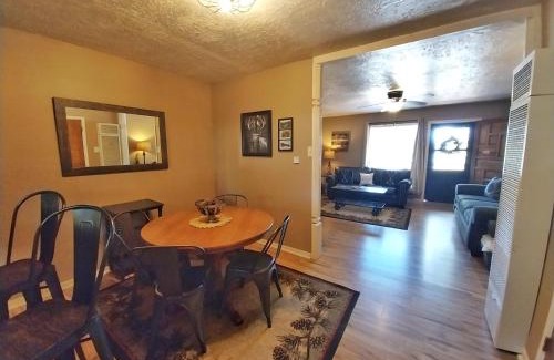 Red River House | Valley Condo 125 - Tenderfoot Trail Retreat - Creekside - WiFi - Hot Tub - Fireplace - Washer - Dryer - Playground