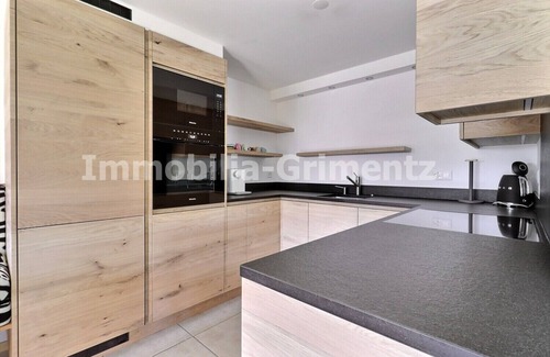 Grimentz Apartment | Very comfortable flat on 2 levels for 5 to 6 people, living room with wood-burner, kitchen area with