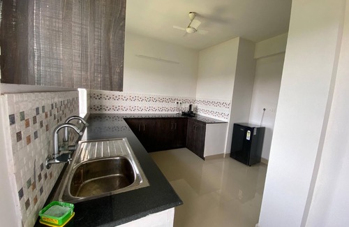 Kumbalam House | Veu Ragamalika Apartment with Fully Equipped Kitchen, Balcony & Caretaker