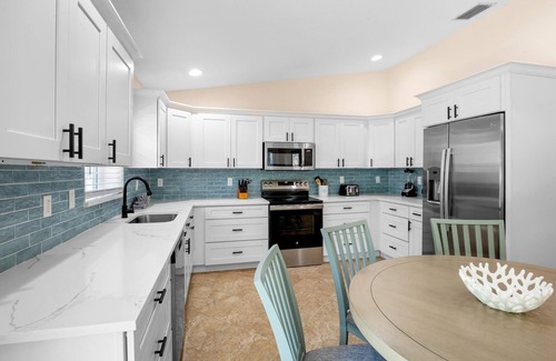 Holmes Beach Cottage | Vibrant Island Retreat with Pool, Tiki Table and Walk to Beach