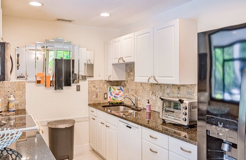 East Naples House | Vibrant villa with private pool, outdoor area, screened lanai, grill, AC, & W/D