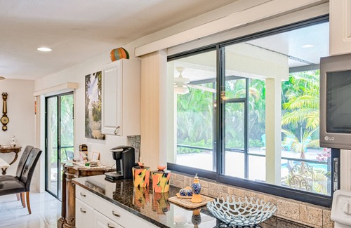 East Naples House | Vibrant villa with private pool, outdoor area, screened lanai, grill, AC, & W/D