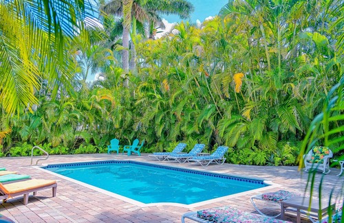 East Naples House | Vibrant villa with private pool, outdoor area, screened lanai, grill, AC, & W/D