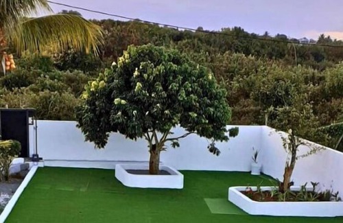 Quatre Cocos House | Villa Bella 2 bed bungalow with stunning garden, pool & only 5 mins from beach.