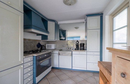 Makkum Villa | Villa on the water with sauna in Friesland