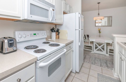 Rehoboth Beach Condo | Villas at Bay Crossing dog-friendly condo with pool, balcony, water views, & W/D