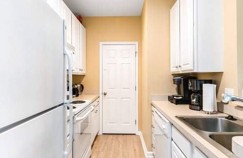 Rehoboth Beach Condo | Villas At Bay Crossing homey condo with pool, beach gear, WiFi, and private W/D