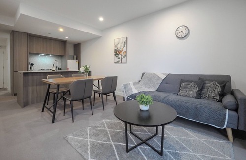 Carlton South Apartment | Walk through the art-filled lobby, neighbour to the world-renowned Royal Melbourne Institute of Technology (RMIT).
