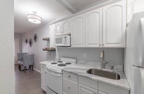 Treasure Island Condo | Walk to beach- 2 PM check in-Boat dock-Pool-amazing views