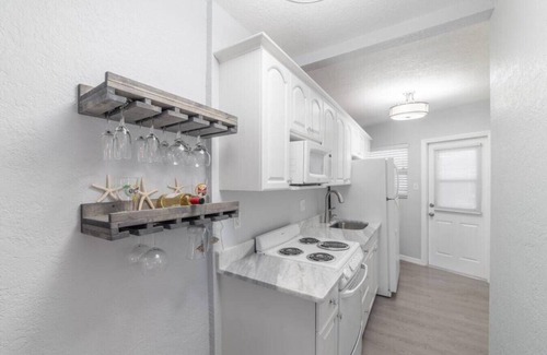 Treasure Island Condo | Walk to beach- 2 PM check in-Boat dock-Pool-amazing views