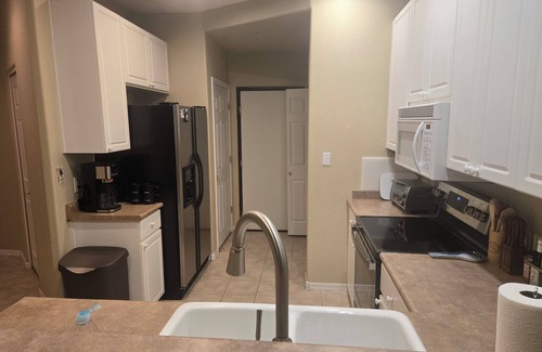 Superstition Springs Condo | Walk to golf and dining from this first floor Superstition Lakes condo near pool