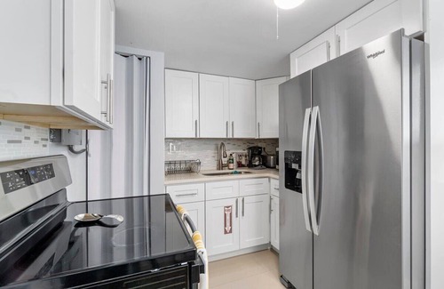 Dolphin Isles Apartment | Walk To The Beach | Fire pit + Pool | Coconut Unit