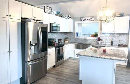Clayton House | Walkable, modern, spacious village home, dockage, hot tub, fenced in yard.