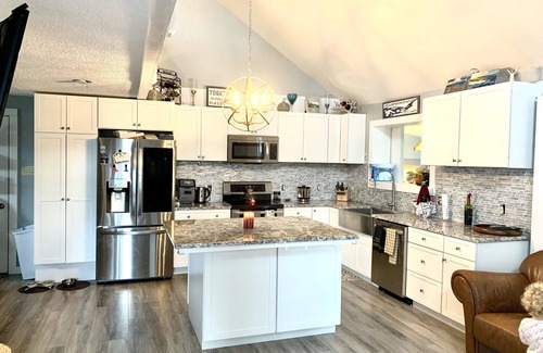Clayton House | Walkable, modern, spacious village home, dockage, hot tub, fenced in yard.