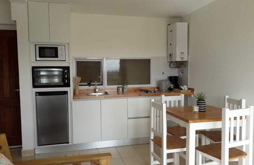 Macrozona Bahia Redonda y Primeros Faldeos Apartment | Warm and modern apartment with lake view