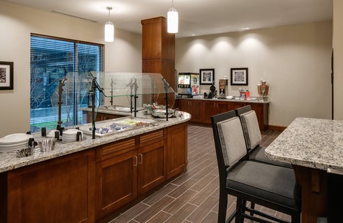 Historic East Village Condo | Warm and Welcoming Suite | Free Breakfast, Indoor Pool + Hot Tub
