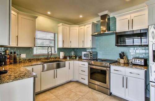 Key Colony Beach House | Watch dolphins play in Shelter Cove while swimming in our oversized pool