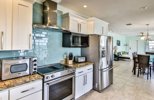 Key Colony Beach House | Watch dolphins play in Shelter Cove while swimming in our oversized pool