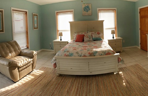 Breezeswept Beach Estates House | Water Front Home. Direct deep water access with private pool/spa/dock & Elevator