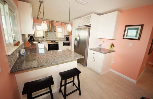 St. George Island House | Water front and side! Pool, Hot Tub, Dock, Game room, Fenced Yard, Dog friendly