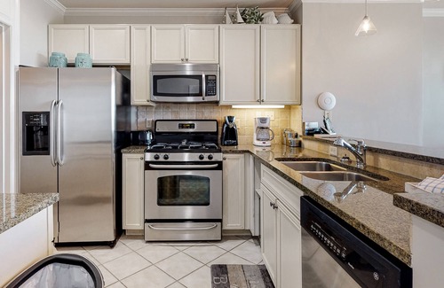Orange Beach Condo | Water-view condo with balcony, pool, hot tub, gym, dining, & shops