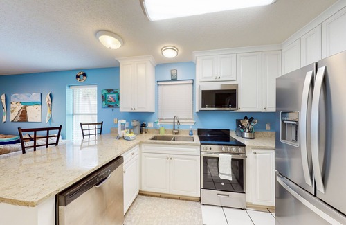 Navarre Beach Condo | Water-view haven with sound-view balcony, shared pool, WiFi, and AC