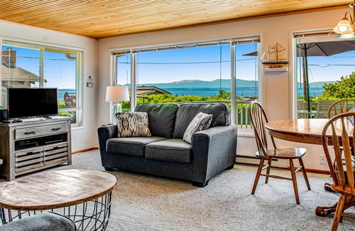 Freeland House | Water-view home with private hot tub & beach access