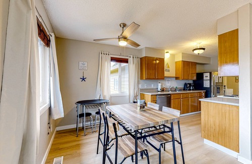 Bay City House | Water view retreat with scenic deck, grill, yard, fireplace, board games, & W/D