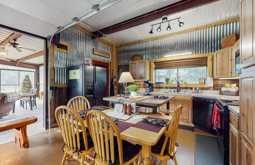 Ledbetter Apartment | Water-view studio near Rummel Square with screened porch, streaming, wood stove