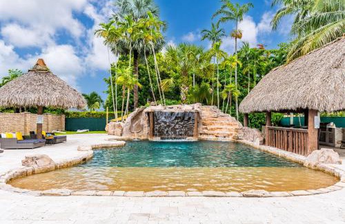 University Park House | Waterfall Cove- resort pool with slide and waterfall
