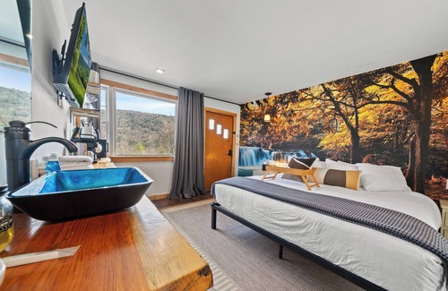 Hancock House | Waterfall Retreat | Serene Room with Forest Mural at Green Acres Retreat