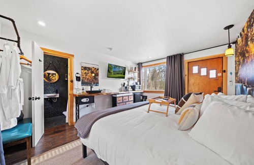 Hancock House | Waterfall Retreat | Serene Room with Forest Mural at Green Acres Retreat