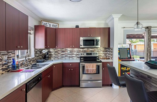 Miami Gardens House | Waterfront 3BR with Pool, Tiki Hut & Mini Golf