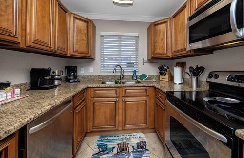 Treasure Island Condo | Waterfront Condo Pool Fishing Docks Across from the Beach
