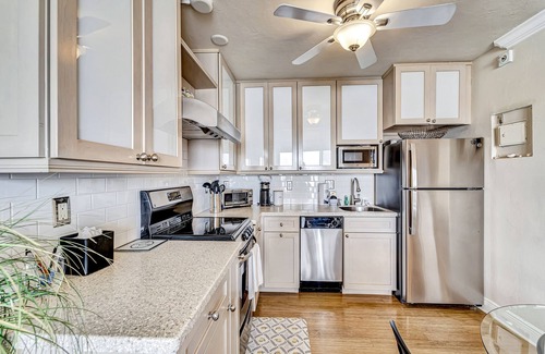 Fort Myers Beach Condo | Waterfront condo with private beach area, pool, hot tub, grills, & balcony