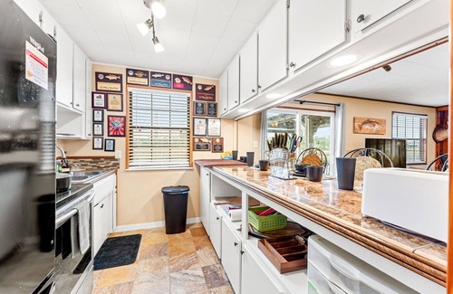 Northside Cabin | Waterfront Fishing Lodge, King Bed, Stovepipe Fireplace