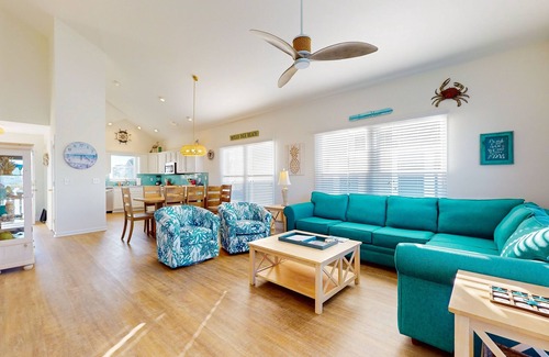 Ocean Isle Beach House | Waterfront home near the beach with outdoor gathering areas, pools & piers