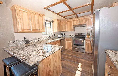 Tahoe Keys House | Waterfront Home with Mountain Inspired Decor, Private Hot Tub and Boat Dock.