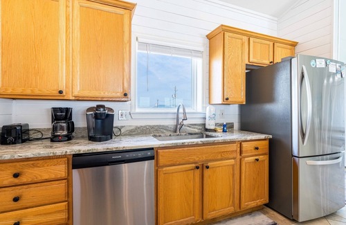 Dauphin Island House | Waterfront home with wraparound deck, BBQ, spacious interior, & W/D